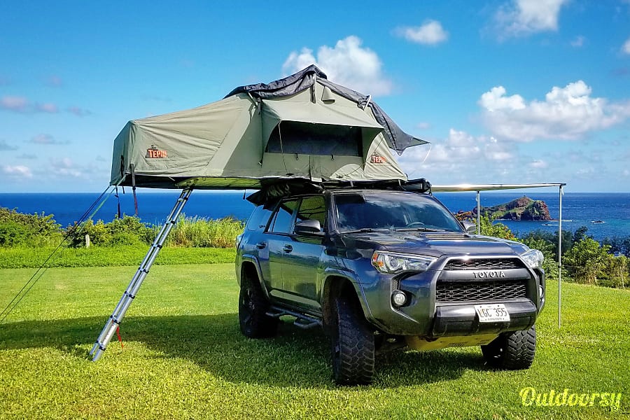 Toyota 4Runner with roof top tent camped in nature