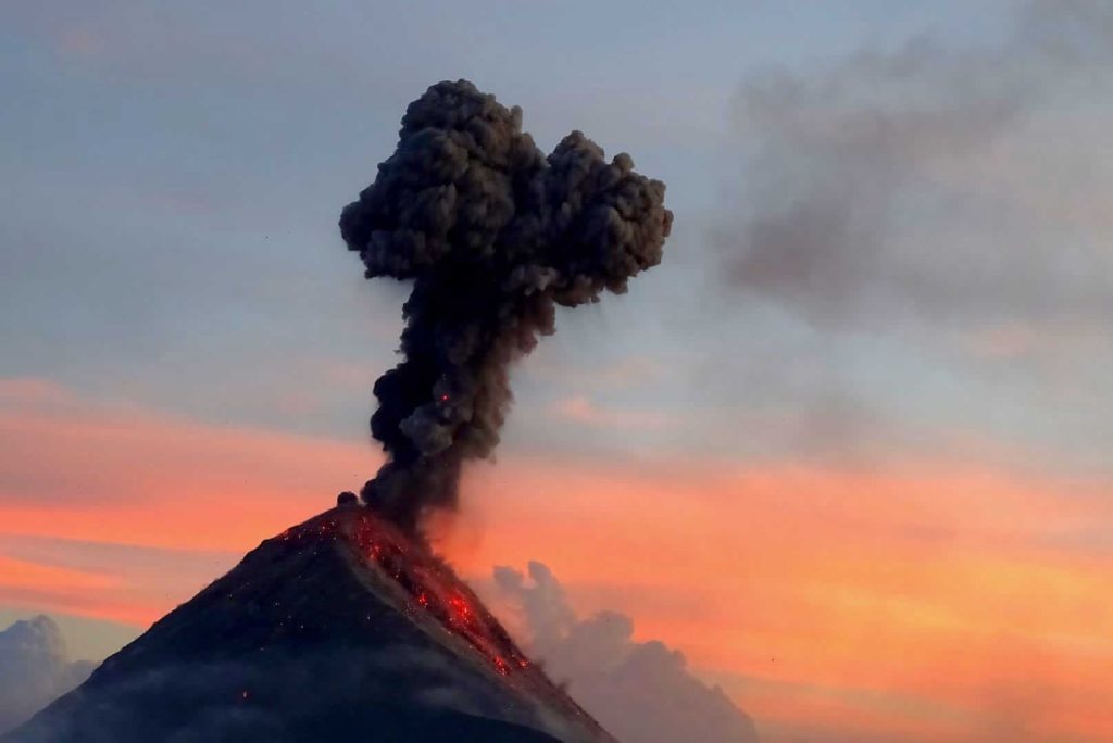 Fuego volcano erupting at sunset near Acatenango volcano