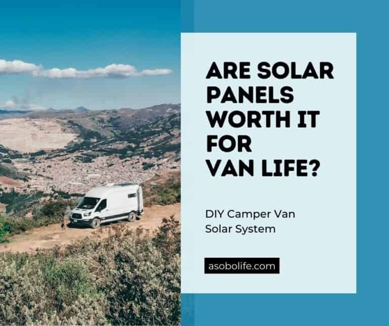 Camper van camping on a sunny hillside and harvesting energy with its solar panels