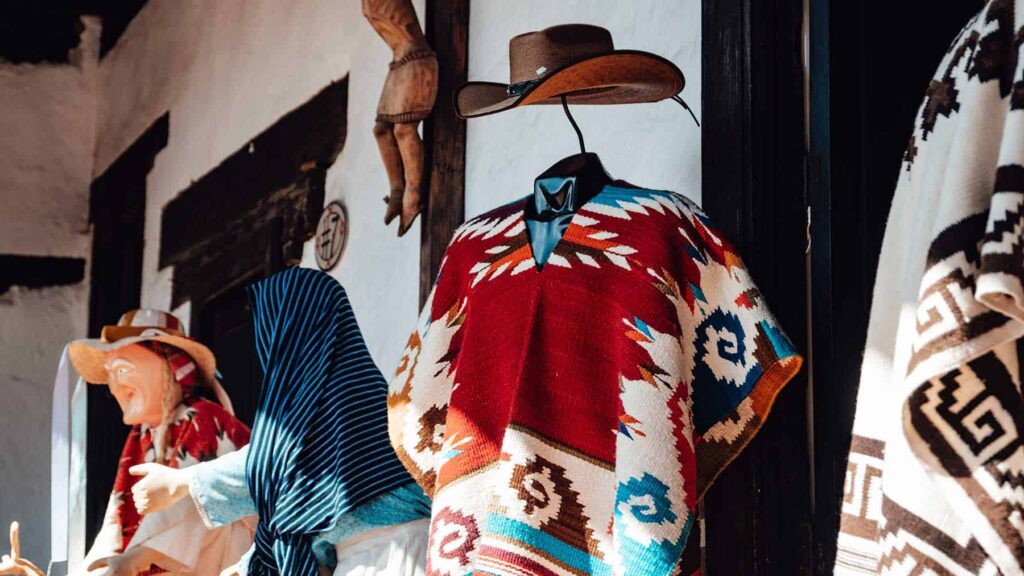 Arts and crafts shop in Patzcuaro selling ponchos and hats