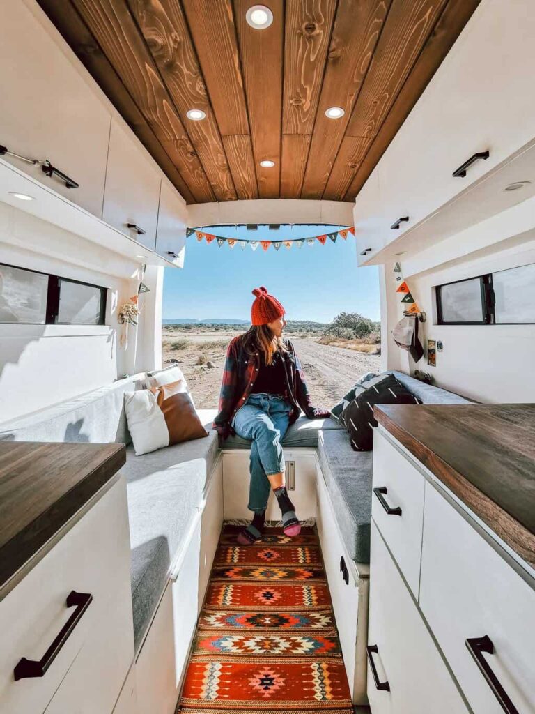 Woman in sitting in a camper van