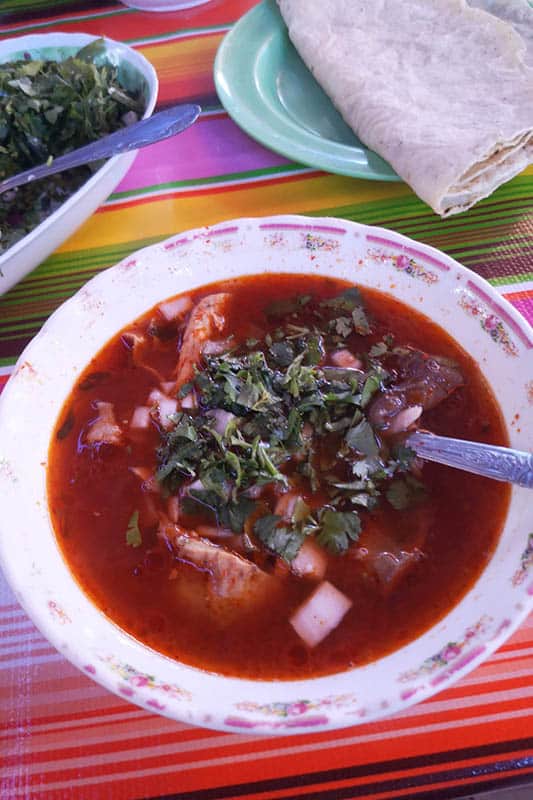 Traditional pork soup with cilantro on top
