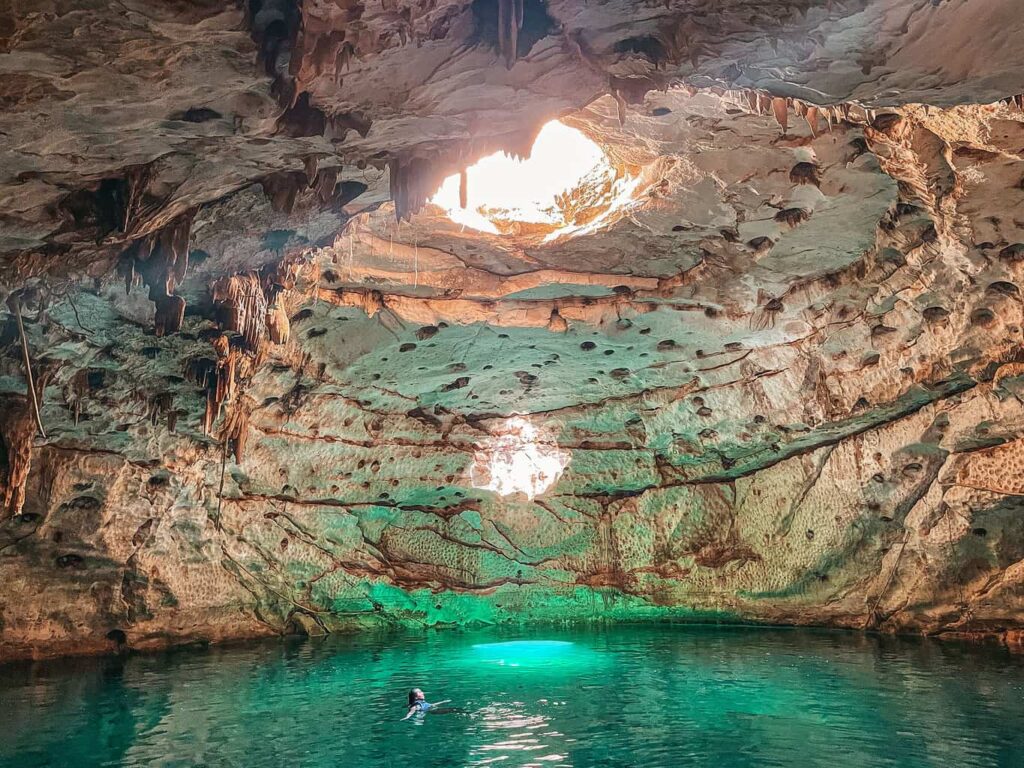 Yuko swimming inside the Hool Kosom cenote near Merida, Mexico