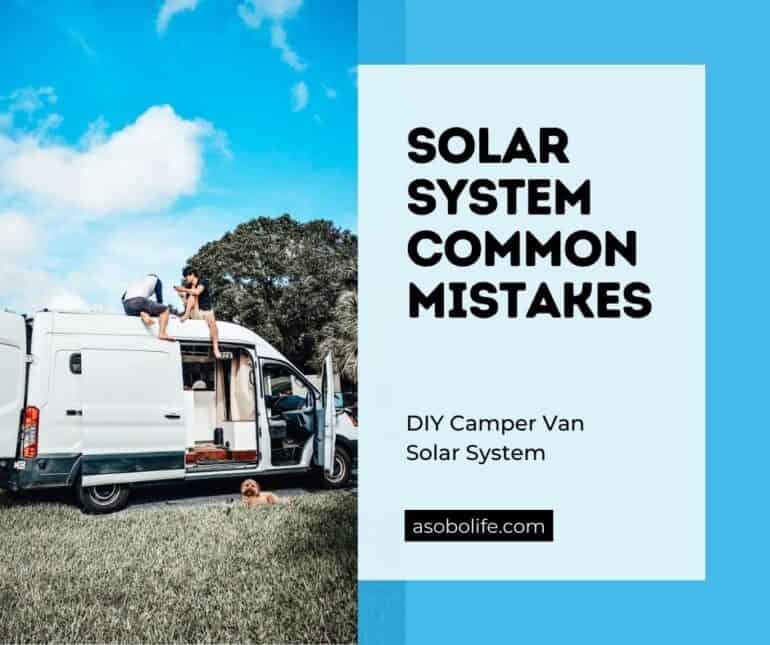 Two people troubleshooting a solar system on top of a camper van