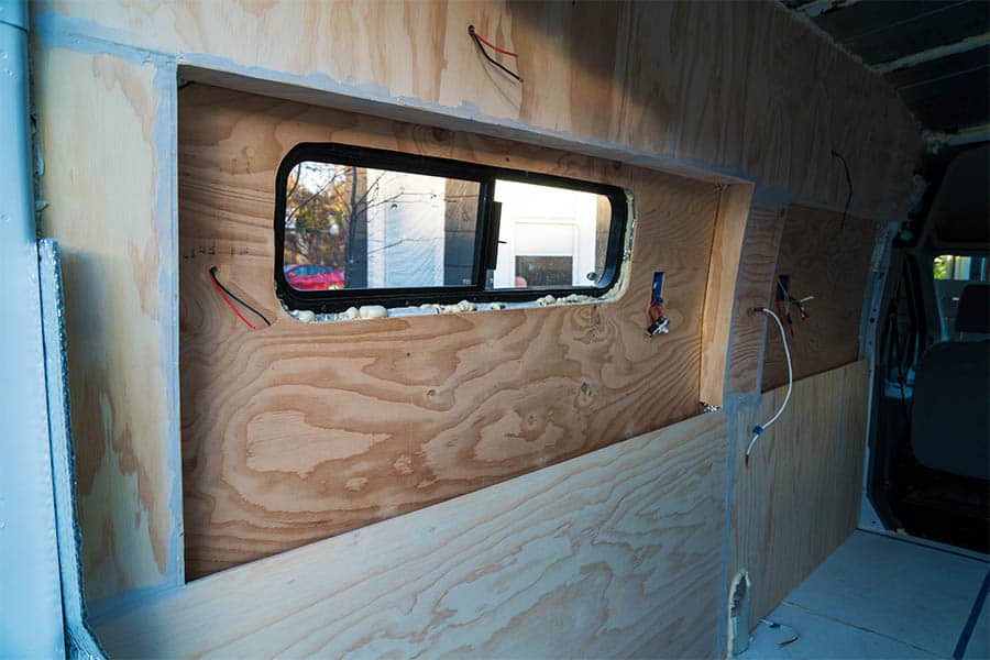 Installing camper van walls - adding spackle to our walls