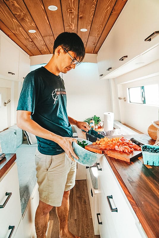 Making a salad inside a camper van