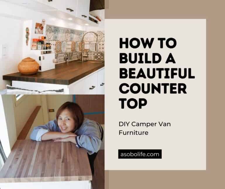 Woman kneeling next to a butcher block kitchen countertop