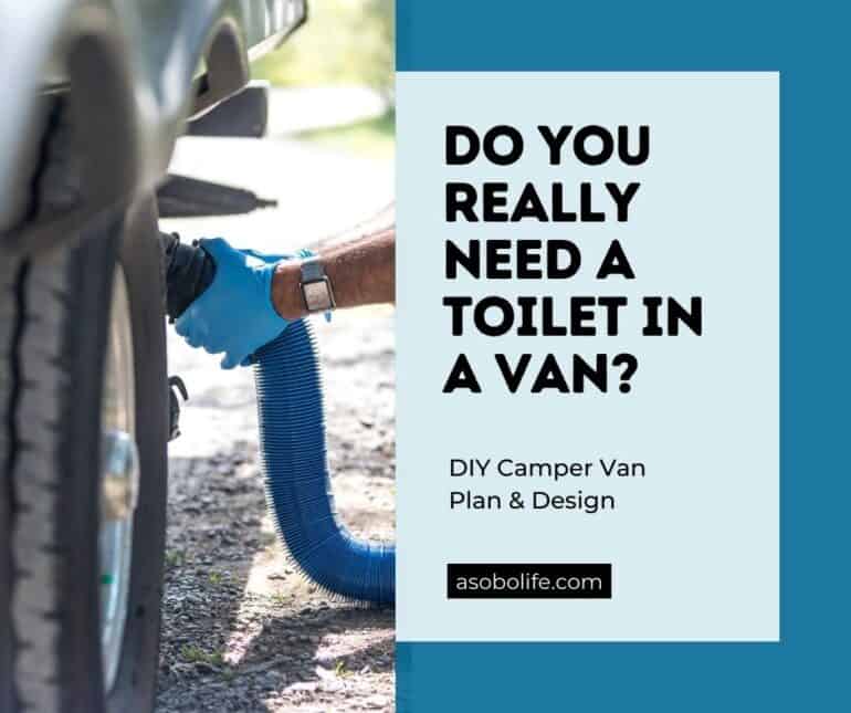 Black water plumbing being connected to the underside of a camper van.