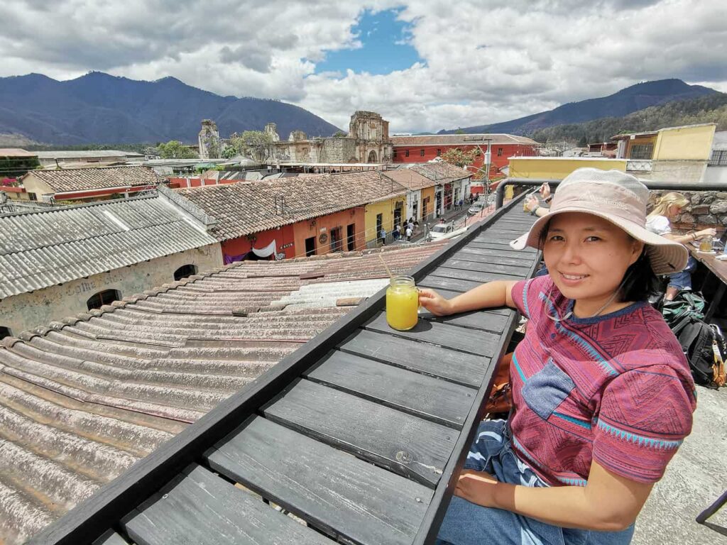 Yuko having a drink at a rooftop cafe overlooking the town of Antigua, Guatemala