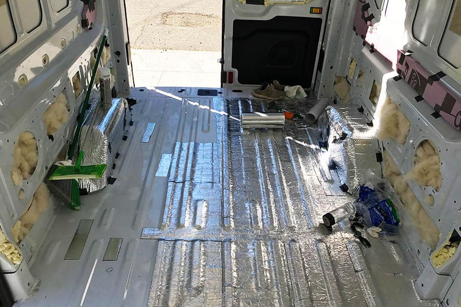 Adding duct insulation to the floor of our camper van