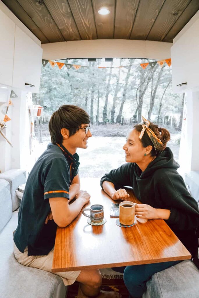 A couple having a conversation in their camper van