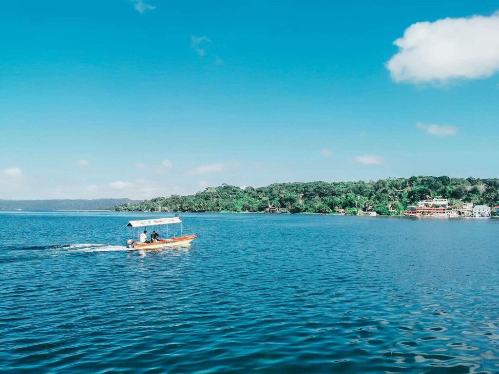 Boat on the waters around Flores Island in Guatemala
