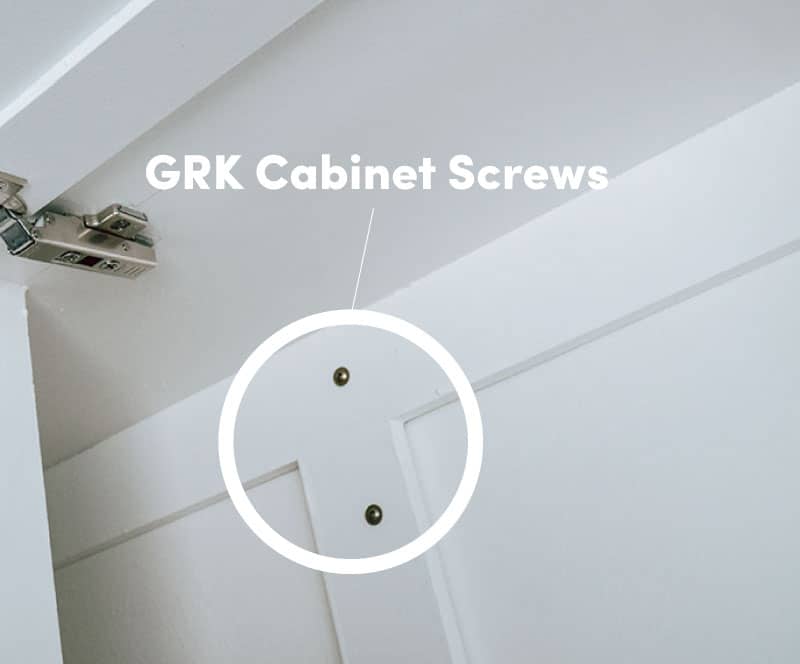 Two GRK cabinet screws installed in an overhead cabinet