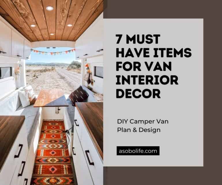 Couch, table, and throw pillows inside a camper van.