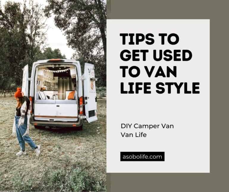 A woman standing outside next to a camper van