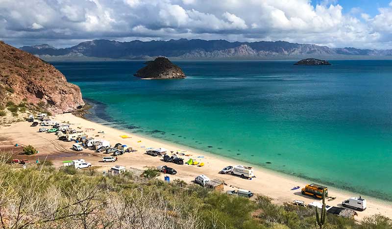 Camper vans parked along the beach in Baja Mexico