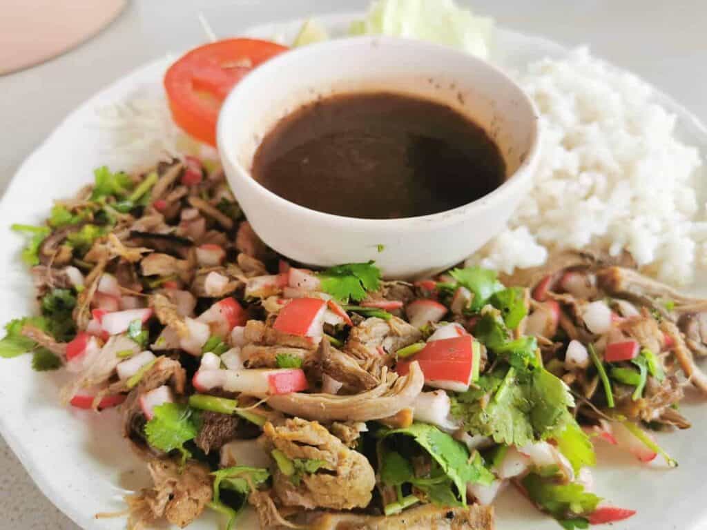 Lunch plate with rice and fried meat and vegetables