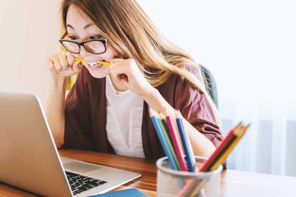 Woman studying in front of laptop