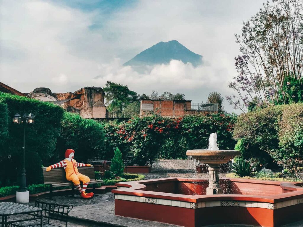 Courtyard inside McDonalds in Antigua Guatemala with Volcano Agua in the background
