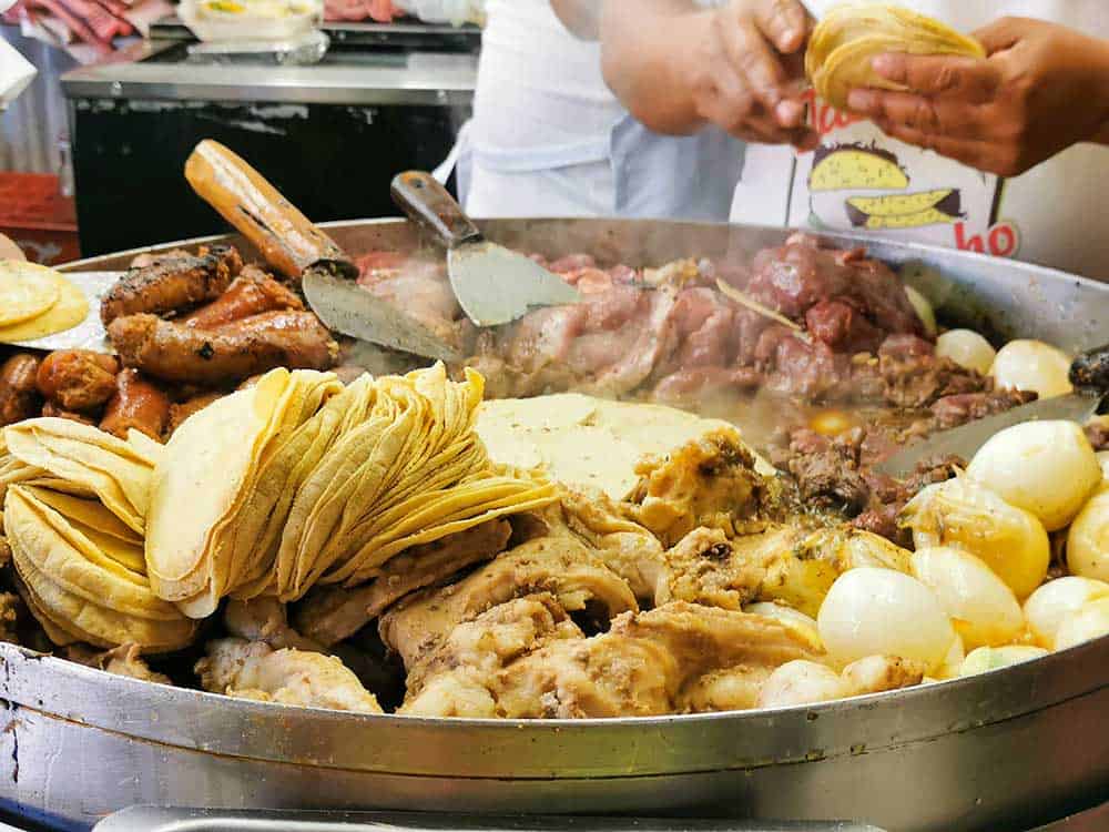 Meat stewing in a pot for tacus