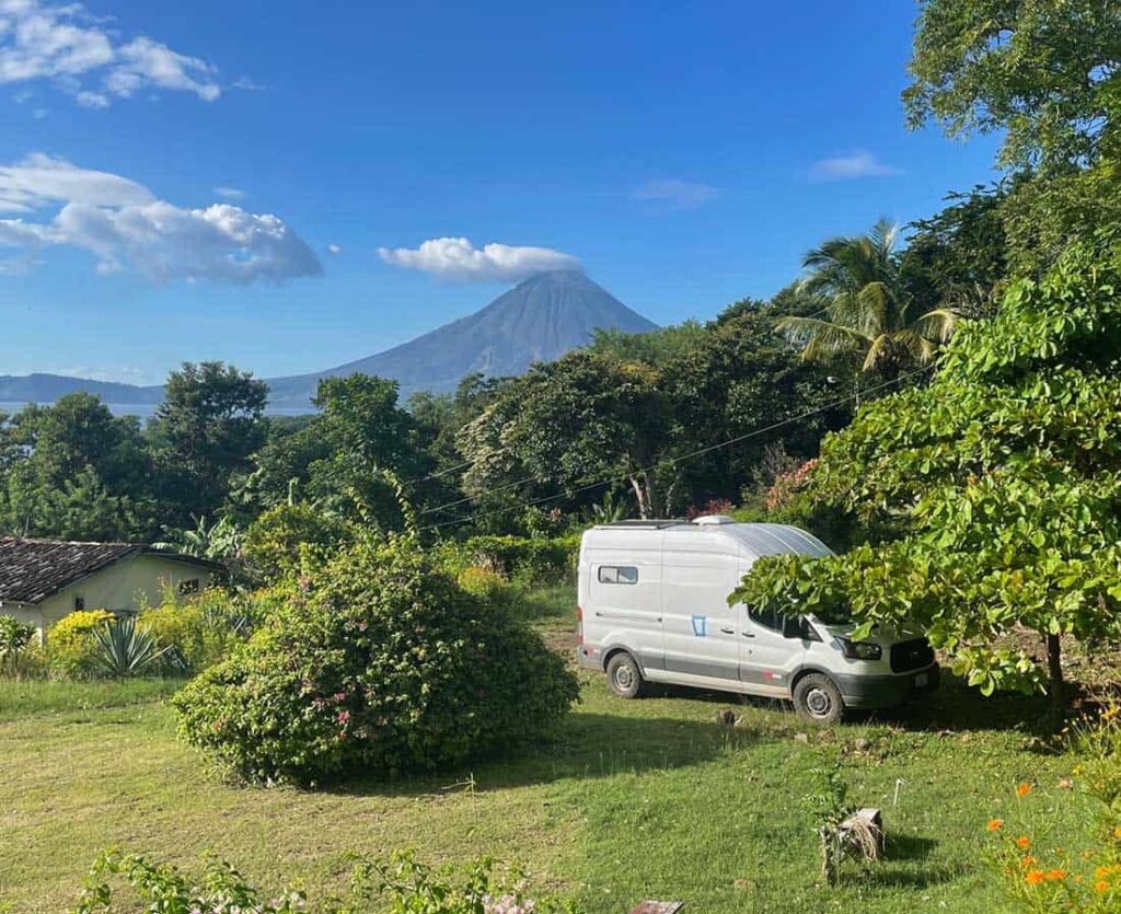 Camper van parked on a grassy field in Ometepe Island, Nicaragua