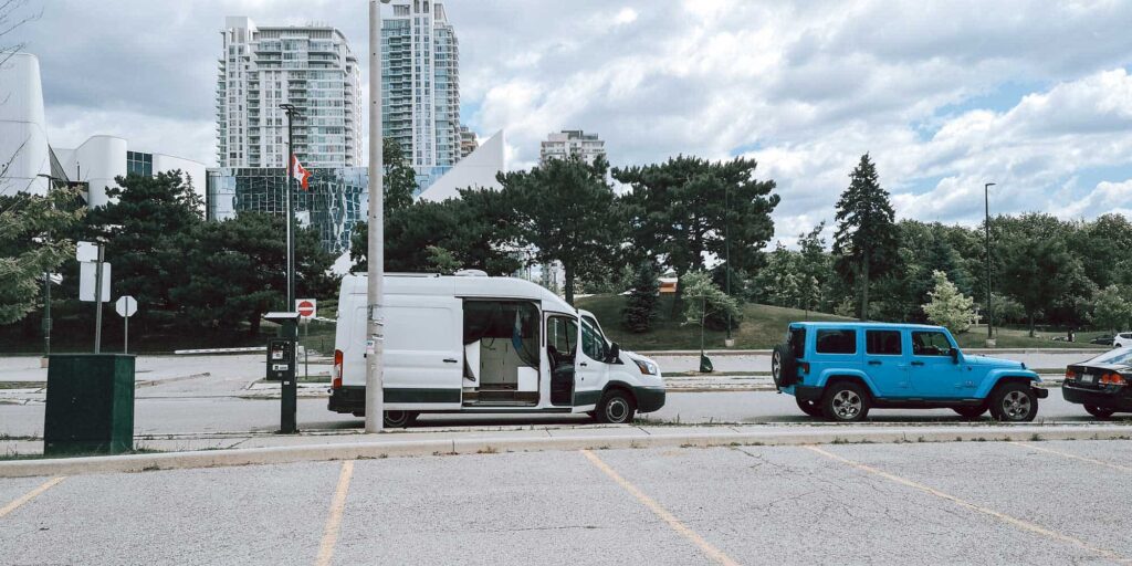Ford Transit camper van parked on the street in Canada