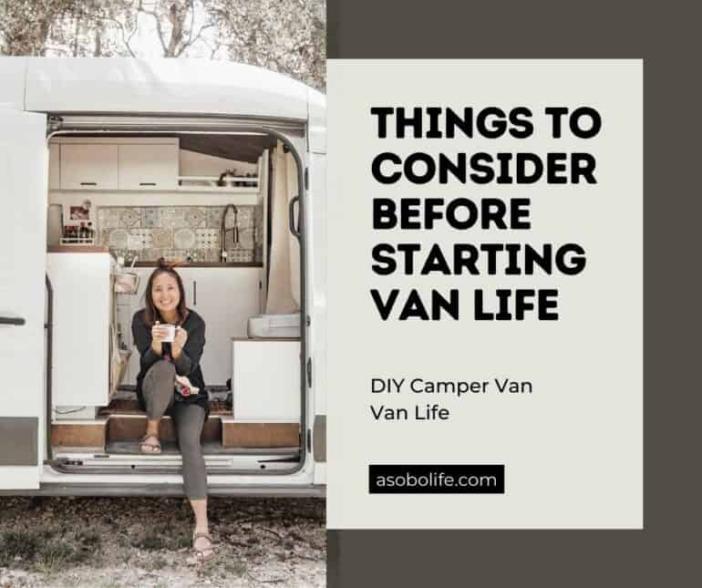 A woman sitting inside a camper van with a cup of coffee