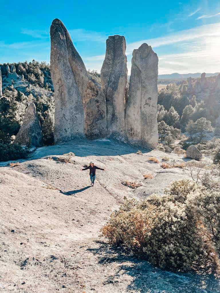 Yuko standing in front of stone monuments at Valle de Los Monjes, Mexico