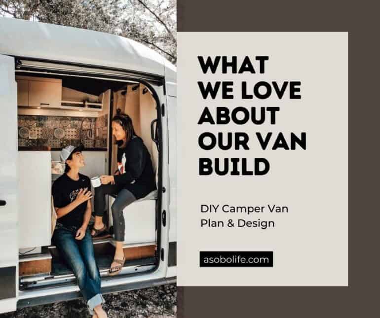 A couple sitting inside their camper van sharing a cup of coffee and enjoying their van conversion.