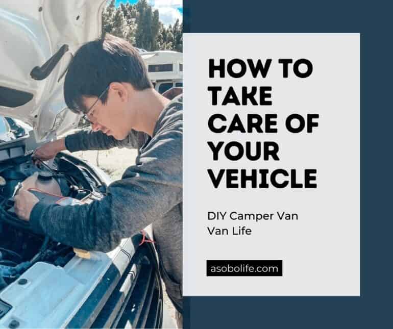A man conducting routine maintenance on a camper van engine