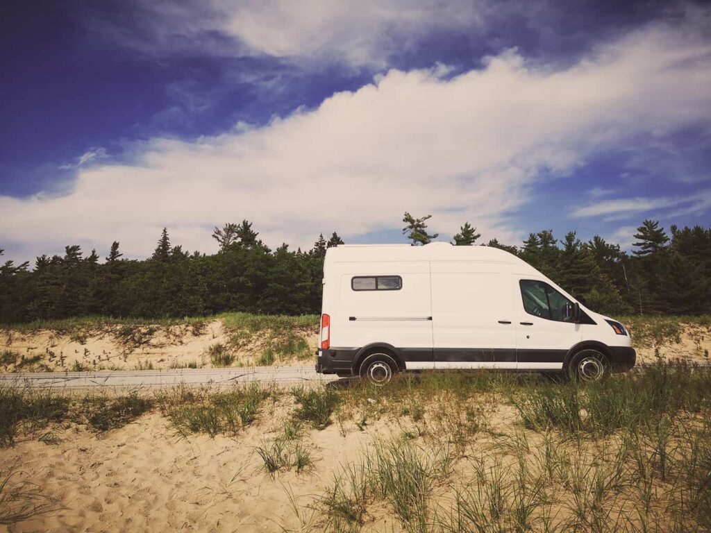 Ford Transit camper van parked by the side of the road