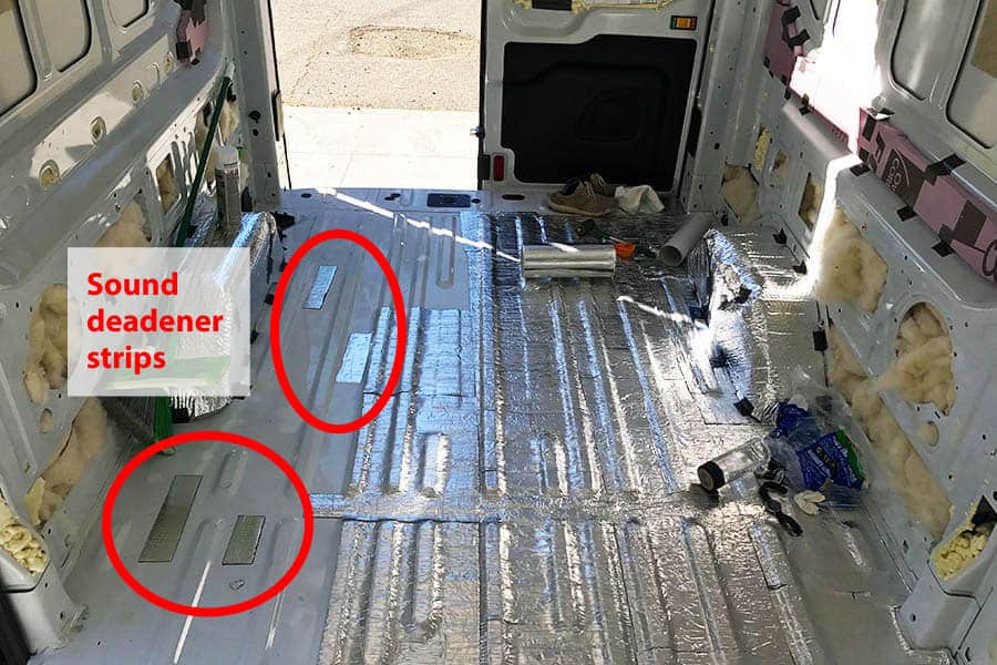Camper van floor indicating location of sound deadener strips