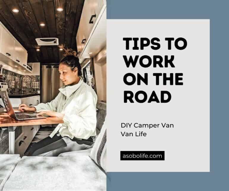 A woman working on a laptop that is connected to WIFI inside a camper van