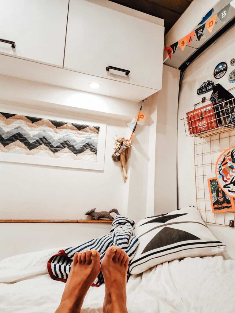 Camper van interior with reflectix window cover