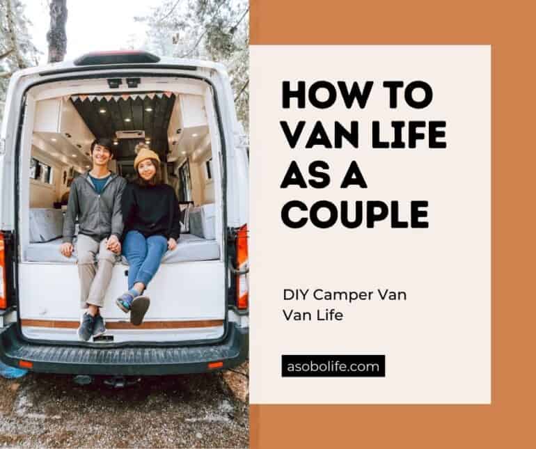 A couple sitting out the back of a camper van