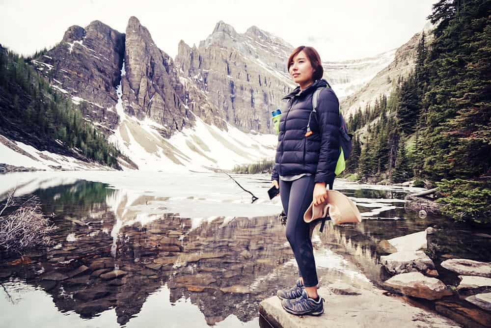 Woman standing in front of a lake in Banff National Park