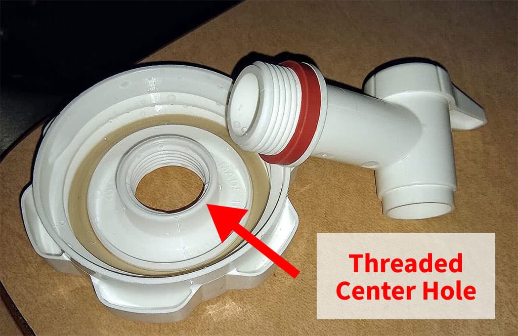 Reliance Aqua-Tainer water container cap indicating the center threaded hole