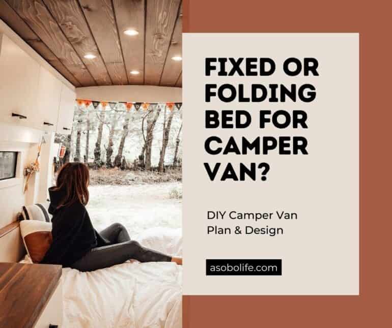 A woman sitting on her bed inside a camper van.