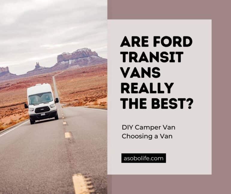 A Ford Transit camper van driving on a desert road.