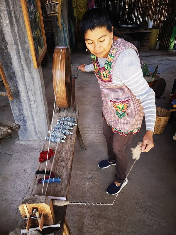 Spinning wool for a new Mexican wool rug
