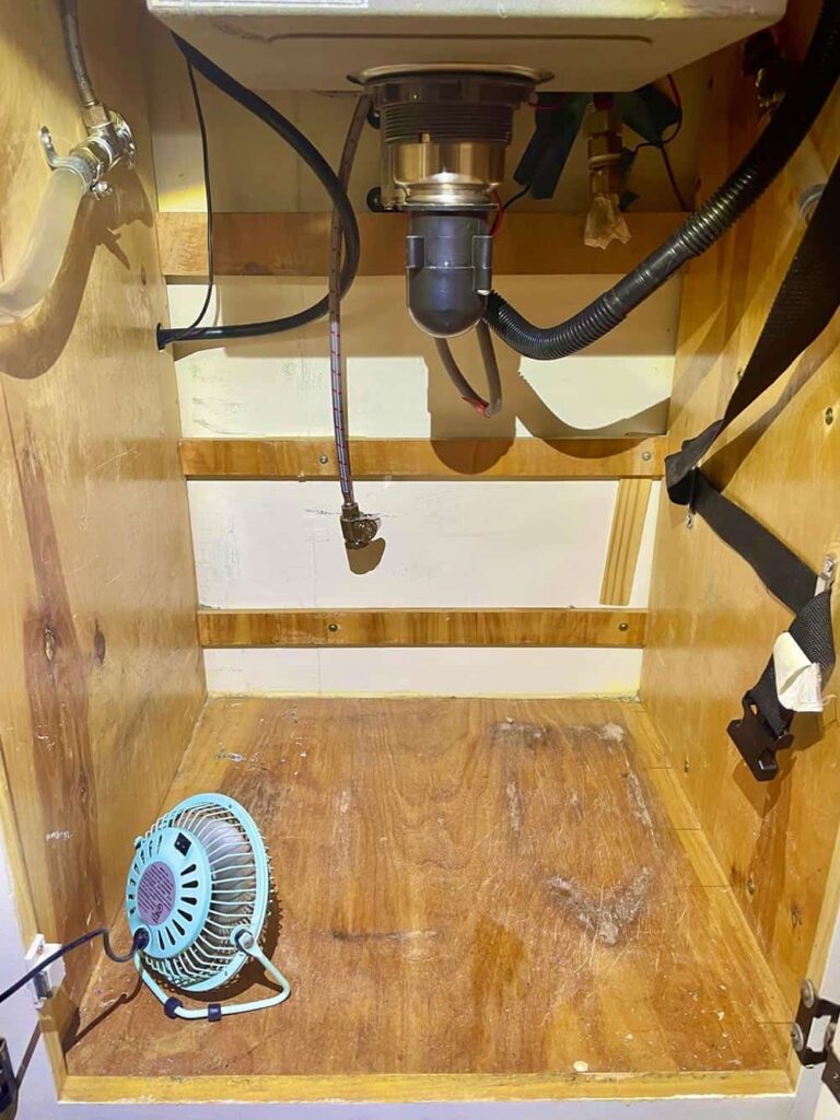 Mold growing under camper van sink